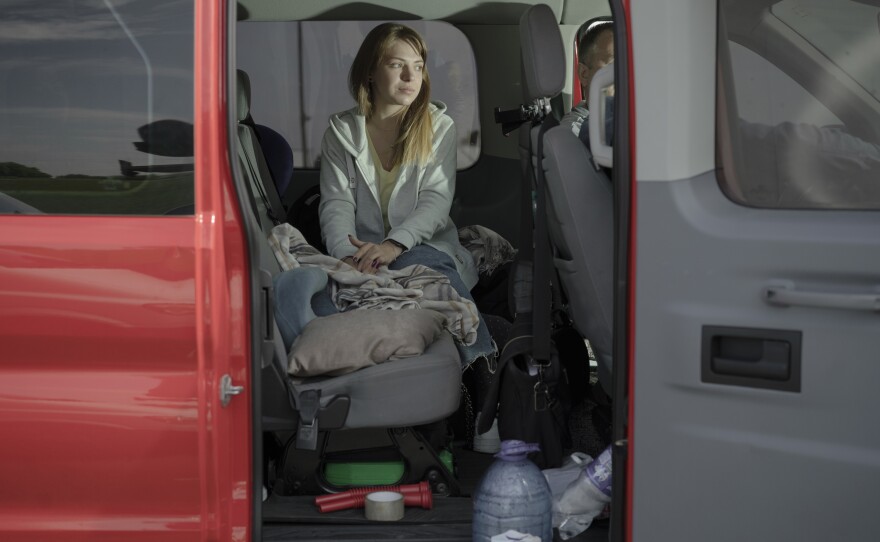 Anna Kobernyk waits in van at the Poland-Ukraine border.