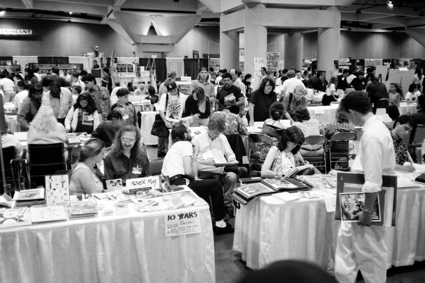 Artists' Alley at the 1992 Comic-Con convention teems with life as fans meet with artists.
