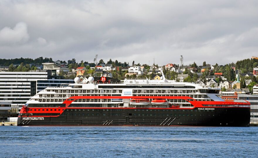 The expedition cruise ship MS Roald Amundsen is moored at a quay in Tromso, Norway, on Saturday. At least 36 crew members from the ship have tested positive for the coronavirus.