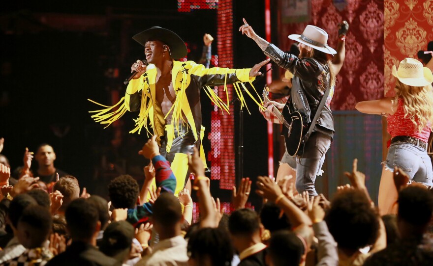 Lil Nas X and Billy Ray Cyrus perform onstage at the 2019 BET Awards.