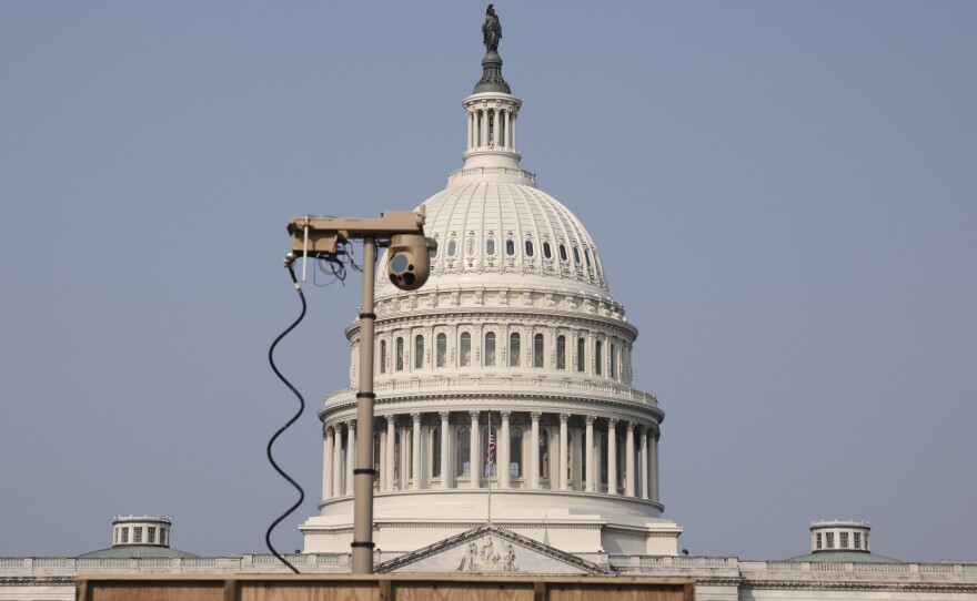 A recently installed surveillance camera is seen positioned near the U.S. Capitol on Monday.