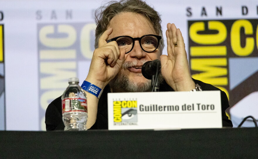 Guillermo del Toro mimes shooting a movie during a panel for Pan's Labyrinth 20th Anniversary release. 