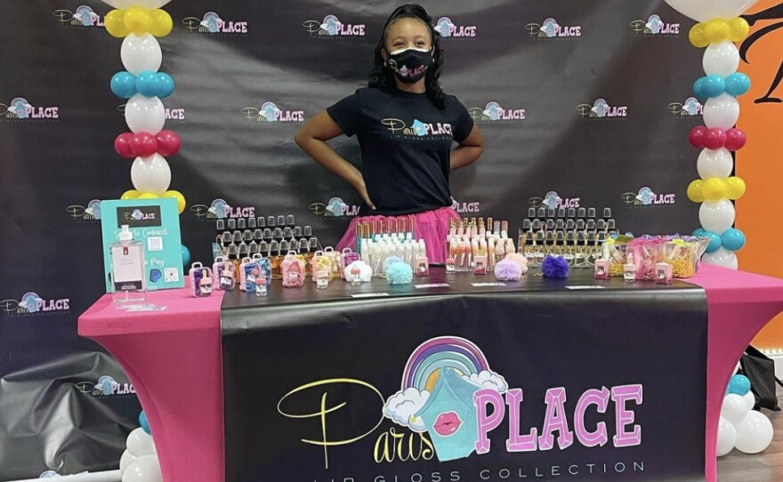 Paris Muhammad, CEO of Paris Place LLC, at the ribbon-cutting ceremony celebrating the moment she made history as the youngest member of the Conyers-Rockdale Chamber of Commerce in Georgia.