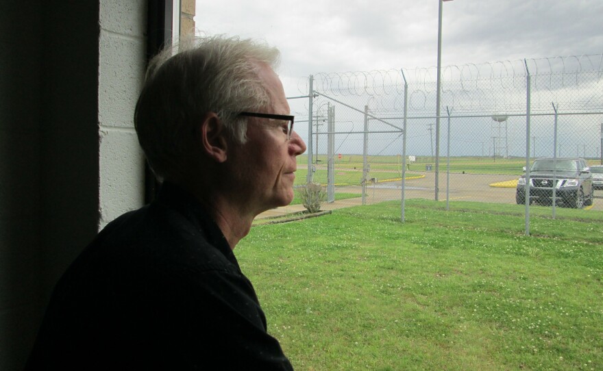 Professor Adam Gussow looks out the window of his classroom inside the sprawling Mississippi State Penitentiary, located on 28 square miles of the Mississippi Delta.