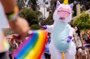 A person in a unicorn costume marches down the streets of Hillcrest as part of the San Diego Pride Parade, July 16, 2022.