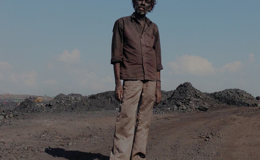 This laborer at a mine in Jharia earned $2 for loading four trucks with coal.