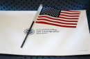 An information packet and an American flag are placed on a chair at the U.S. Citizenship and Immigration Services Miami Field Office on Aug. 17, 2018, in Miami.