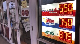 Powerball and Mega Millions lottery and Florida Lotto jackpots are displayed at a retailer, Wednesday, Jan. 13, 2021, in North Miami Beach, Fla.