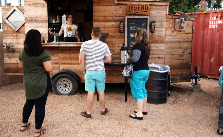 Annie Welbes serves customers at her Legend Coffee Company next to Franklin Barbecue in Austin.