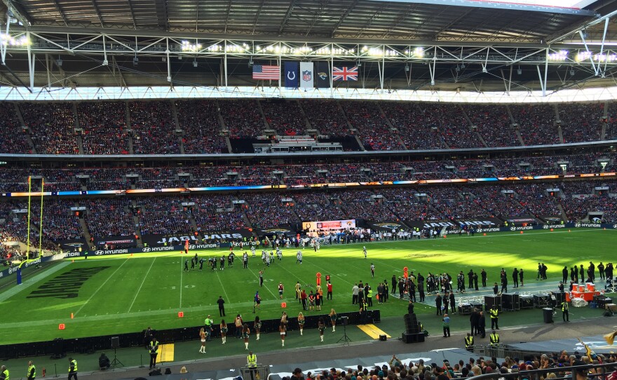 Thousands of fans wearing jerseys representing all 32 NFL teams attend opening day of the NFL's International Series at London's Wembley Stadium on Sunday.