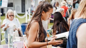A visitor peruses the books at a previous San Diego Union-Tribune Festival of Books, shown in an undated photo.