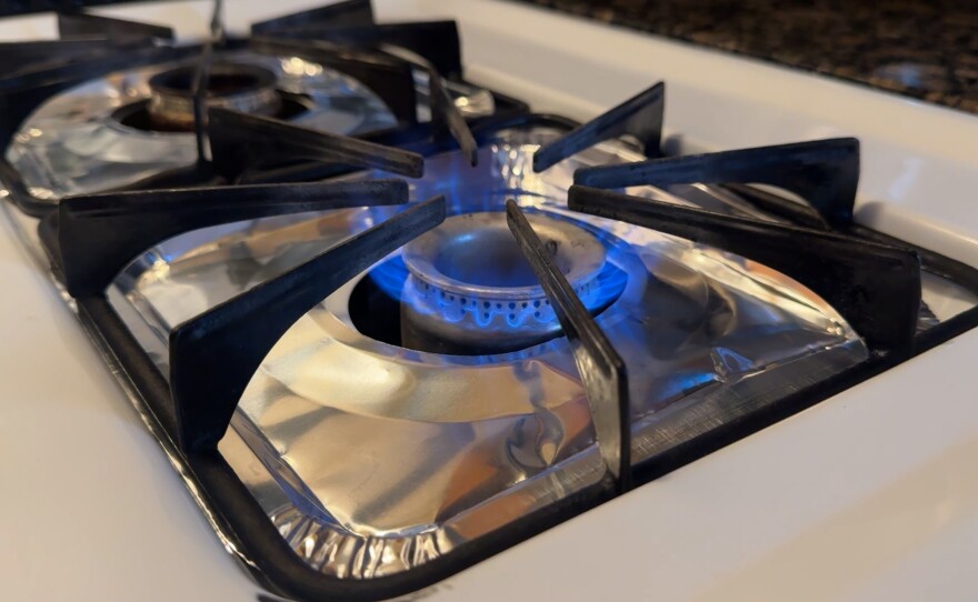 A natural gas burning stove with the gas on is shown in this undated photo.