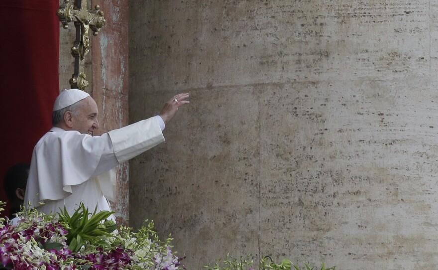 Pope Francis delivers the Urbi et Orbi blessing at the end of the Easter Sunday Mass in St. Peter's Square at the Vatican, on Sunday.