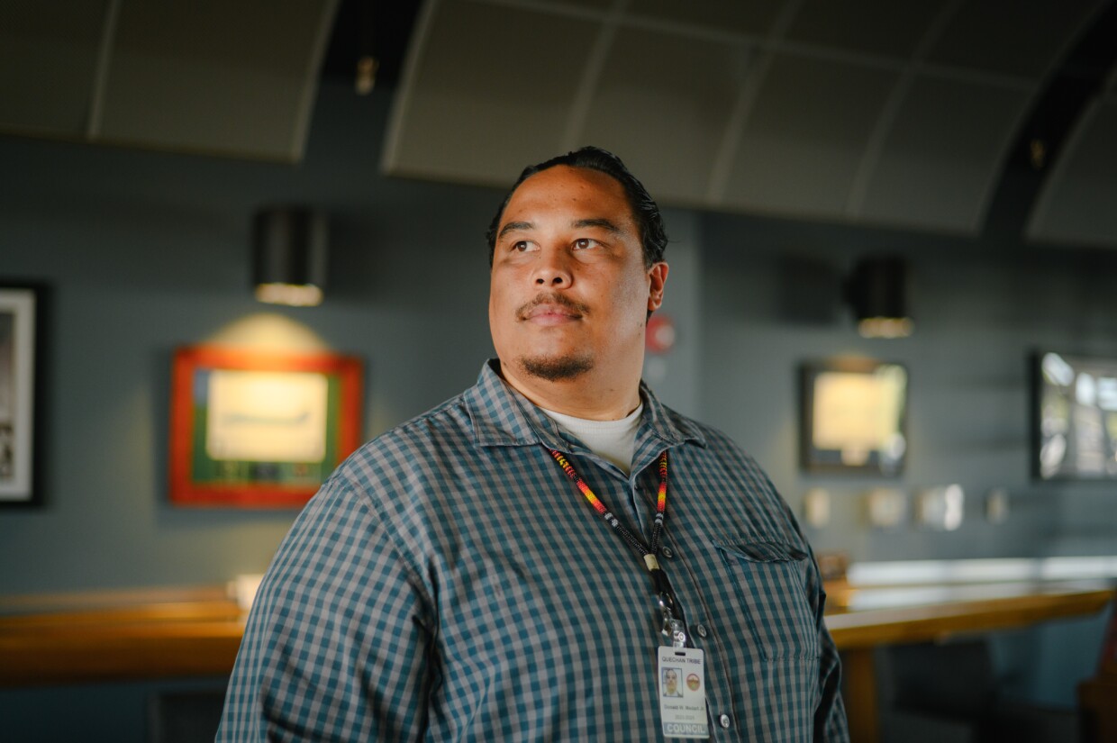 Donald Medart Jr., a Tribal Councilmember with the Fort Yuma Quechan Indian Tribe, stands for a portrait at an airfield near the Yuma Airport in Yuma, Arizona on Oct. 16, 2024. Medart has been guiding passengers during Ecoflight flyovers of the proposed Kw'tsán National Monument, which would grant new federal protection to 390,000 acres of the Tribe's homelands along the California-Arizona border.