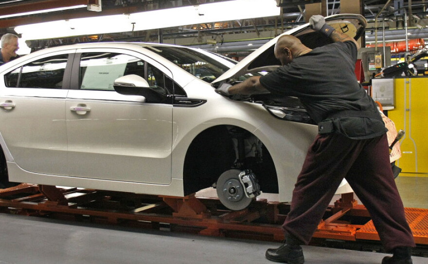 Workers assemble a Chevrolet Volt at GM's Detroit Hamtramck Assembly Plant in October. The auto maker says it will idle the plant for five weeks, to allow demand to catch up with inventory.
