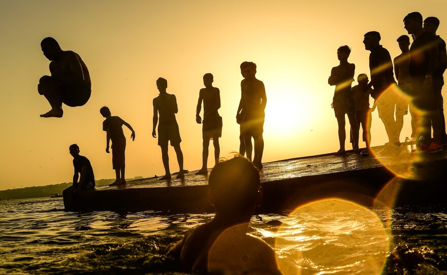 A new report finds that 2017 was one of the hottest years ever recorded. Here, a man dives into the sea in Istanbul in July 2017 during a heat wave that caused record temperatures in much of Turkey.