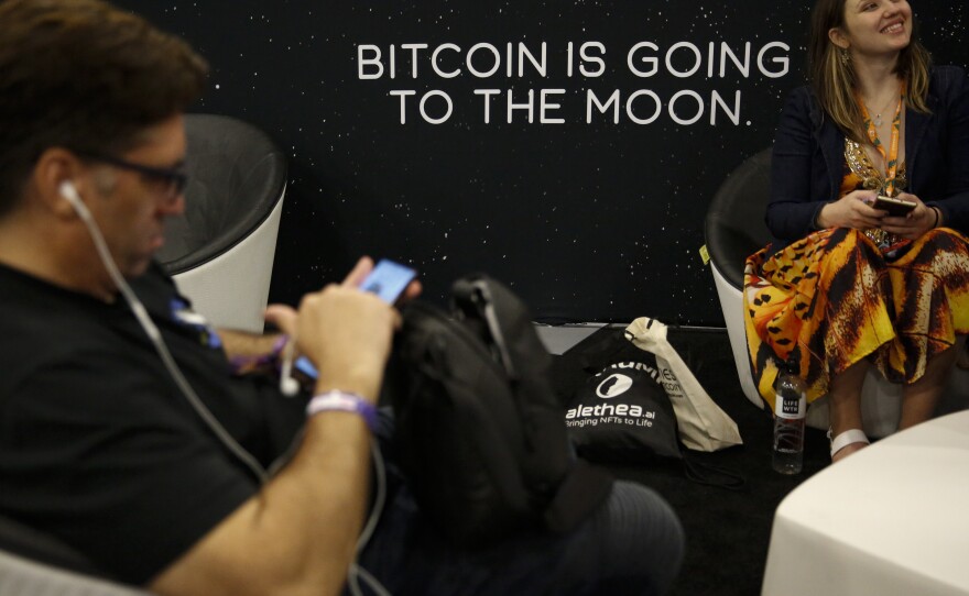 A sign that reads "Bitcoin is going to the moon" is seen during the Bitcoin 2022 Conference at Miami Beach Convention Center in Miami on April 8. The expression has become popular among some Bitcoin enthusiasts.