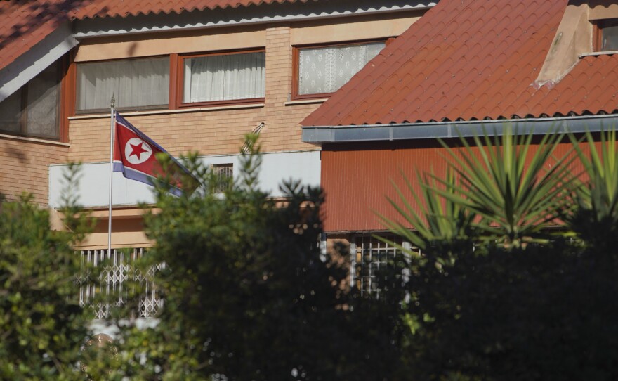 The flag of North Korea waves inside the compound of the North Korean embassy in Rome. North Korea's acting ambassador to Italy, Jo Song Gil, went into hiding with his wife in November, according to South Korea's National Intelligence Service.