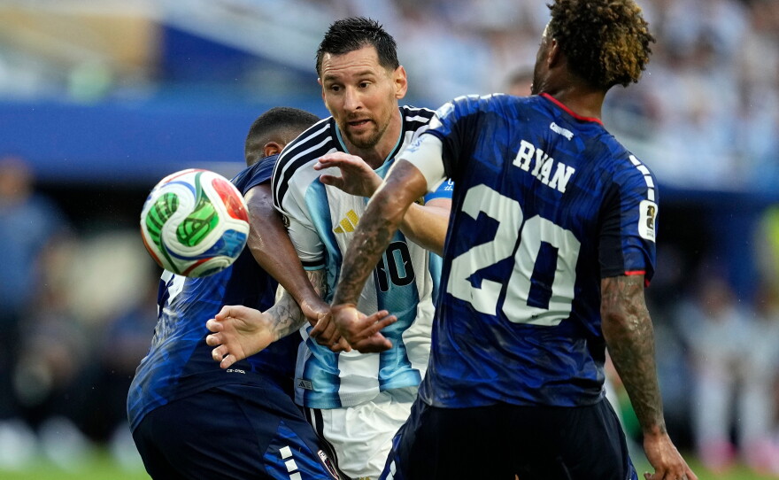 Argentina's Lionel Messi (10) battles with Cape Verde's Deroy Duarte (14) and Ryan Mendes (20) during the World Cup round of 32 soccer match between Argentina and Cape Verde in Miami Gardens, Fla., Friday, July 3, 2026.