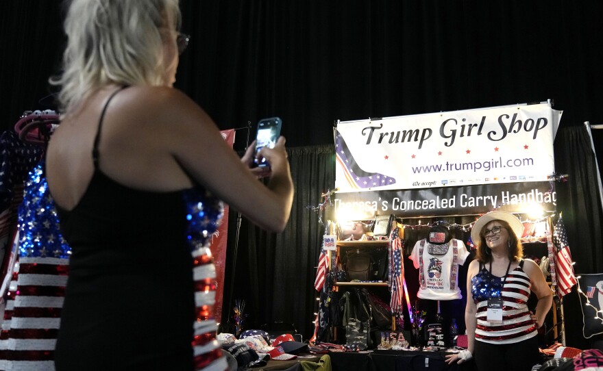 Theresa Hill, of Sarasota, Fla., poses for a photograph at her Trump Girl Shop during the Turning Point Action conference on July 15.