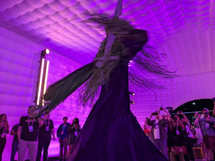 A performer dances dressed as the TwitchCon mascot Grass Lord inside the Dino Lounge at TwitchCon on Sept. 20, 2024 at the San Diego Convention Center.