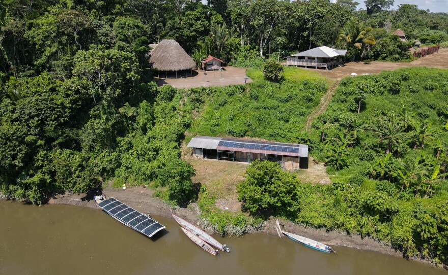 The solar boat and solar charging center at the Achuar village of Sharamentsa in Ecuador.