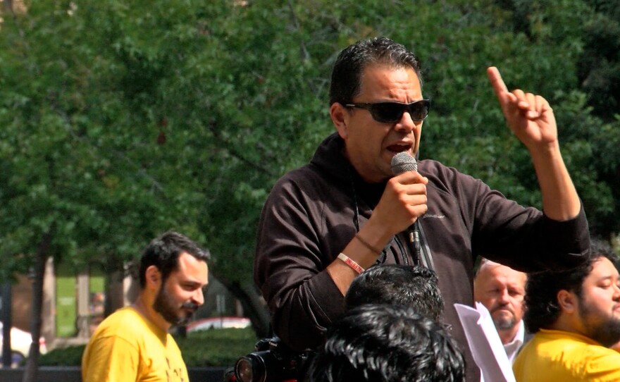 Pedro Rios, director of the San Diego branch of the American Friends Service Committee, speaks to protesters in downtown San Diego on Sept. 18, 2025.