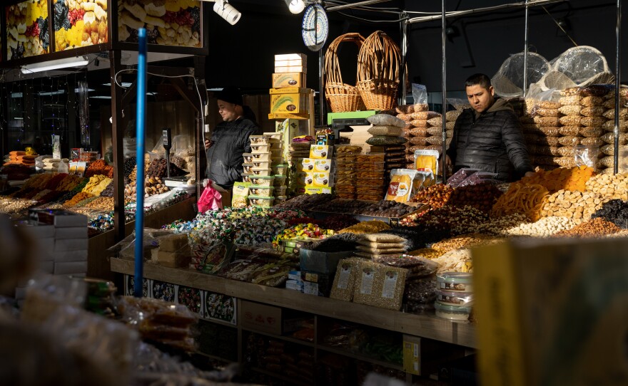 Shop owners wait for customers at a market on Tuesday in Kyiv. Though the U.S. has warned of an invasion by Russia, many Ukrainians do not share the same sense of concern that they feel Western media is creating.