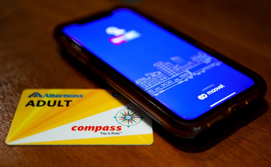 This photo, taken on July 9, 2019, shows MTS’s adult Compass Card and the Compass Card app.