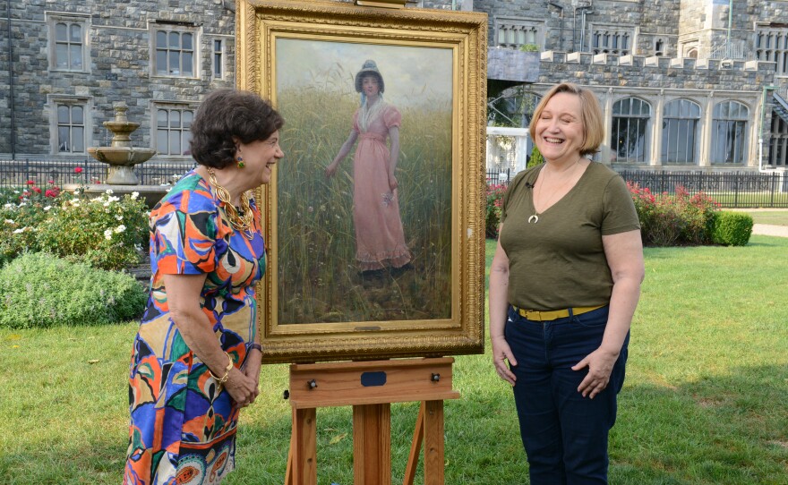 Debra Force (left) appraises an 1882 Hamilton Hamilton “Coming Thru the Rye” oil, in Sands Point, N.Y.