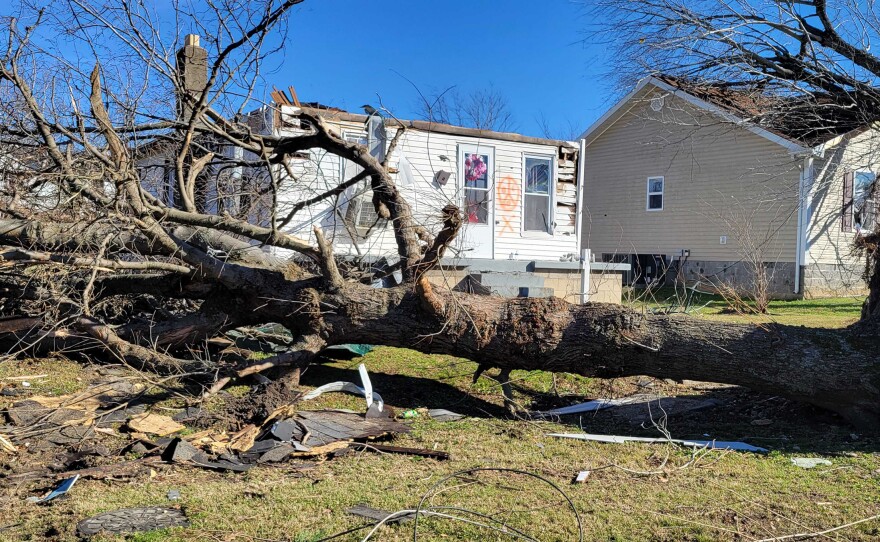 Homes in Dawson Springs are marked with red paint after they've been searched for survivors or victims. The effort of clearing away the rubble and rebuilding will take months, and many homeowners don't have insurance.