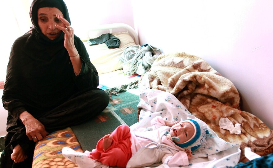 A mother with her malnourished infant at a feeding center in Sanaa, Yemen. According to UNICEF, over a million Yemeni children under age 5 are at risk of malnutrition.