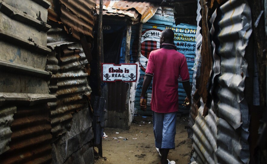 In Liberia, lots of people say Ebola isn't real. This sign in a West Point alley challenges that view.