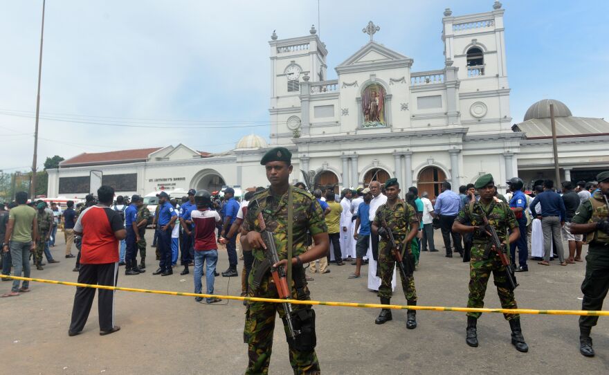 Sri Lankan security personnel keep watch outside St. Anthony's Shrine following the blast at the church.