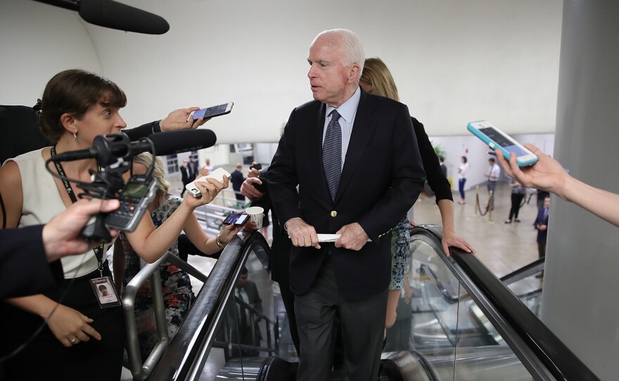 Sen. John McCain, R-Ariz., answers questions from reporters on Capitol Hill earlier this month. He makes his return to the Senate for the first time since being diagnosed with brain cancer last week.