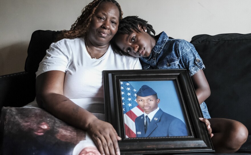 Chantemekki Fortson, mother of Roger Fortson, a U.S. Air Force senior airman, holds a photo of her son.