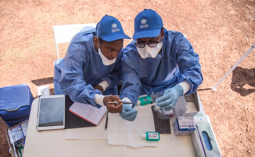 Nurses working with the World Health Organization prepare to administer Ebola vaccines in Mbandaka, a town in the Democratic Republic of the Congo.