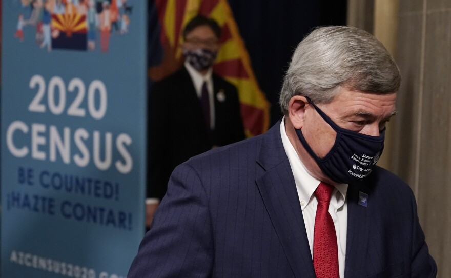 U.S. Census Director Steven Dillingham departs a Sept. 17 news conference in Phoenix. The Trump administration is facing two federal lawsuits over its last-minute decision to cut the 2020 census schedule short.