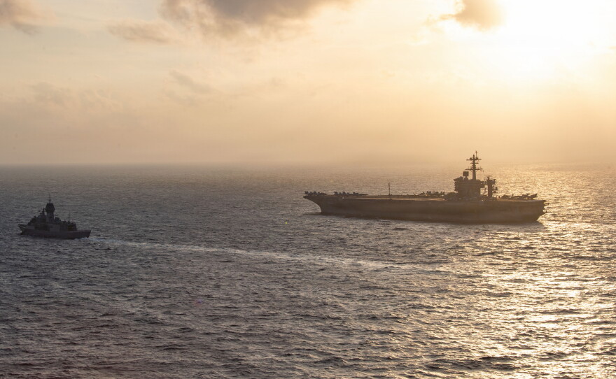 Royal Australian Navy frigate HMAS Perth sails alongside the aircraft carrier USS George Washington in the South China Sea, Aug. 11, 2026.