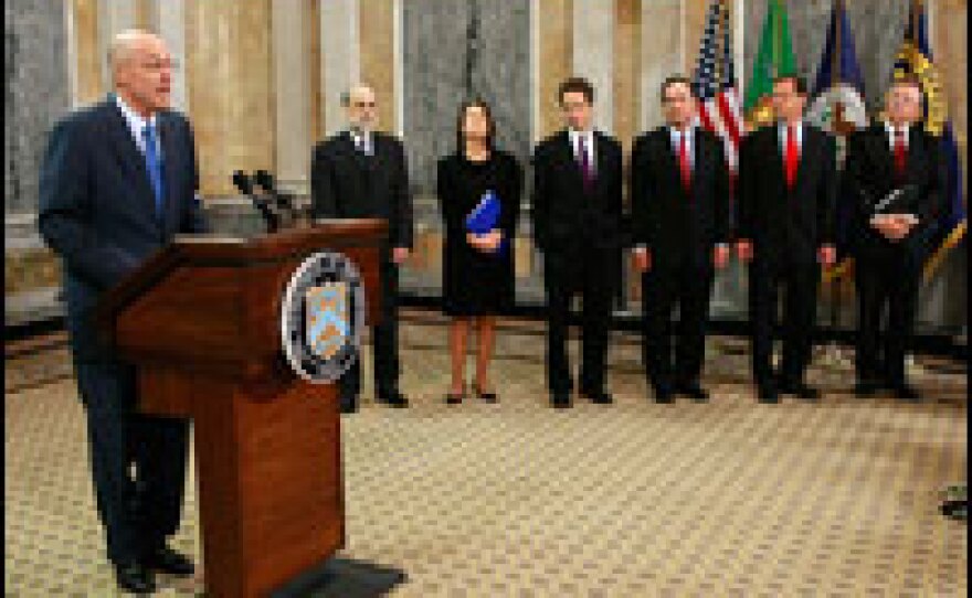 Treasury Secretary Henry Paulson (from left), Federal Reserve Chairman Ben Bernanke, Federal Deposit Insurance Corp. Chairman Sheila Bair and other federal officials gathered Tuesday in Washington, D.C., to announce the government's new plan to invest in banks and insure more deposits.