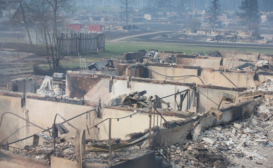 Home foundations are all that remain in a residential neighborhood destroyed by a wildfire on Friday in Fort McMurray.