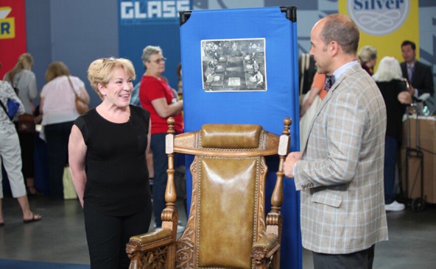 John Nye (right) appraises an Omaha Mayor's Renaissance revival chair in Omaha, Neb.