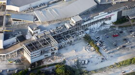 This aerial image shows the damaged AEON shopping center following an earthquake in Kashima, Kumamoto prefecture, southern Japan, Tuesday.