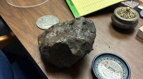 An iron meteorite sits on UC chemistry Professor Mark Thiemens' desk on Aug. 6, 2026.