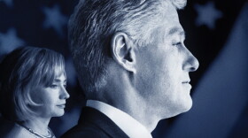 William Jefferson Clinton and Hillary Rodham Clinton in the background. 