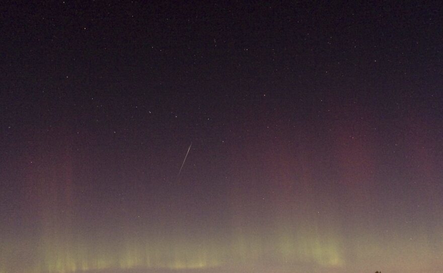 View of a Draconid shooting star and northern light at the Färnebofjärden National Park north of Stockholm, late on Oct. 8, 2011.