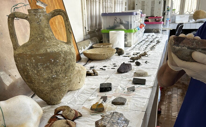 French archaeologist Franck Goddio with an ancient Egyptian artifact.