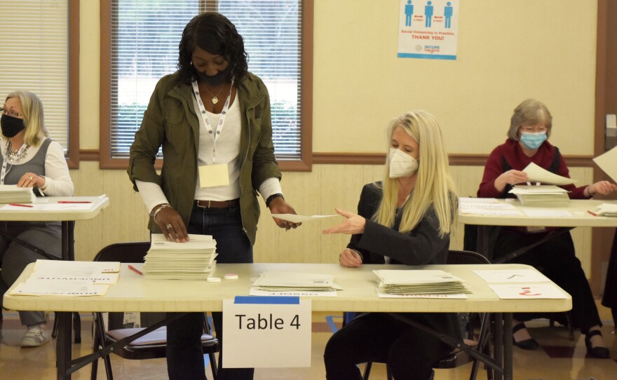 Bartow County, Ga. election workers conduct a full hand count of ballots in the Jan. 5 Senate runoff between former Sen. David Perdue and Sen.-elect Jon Ossoff as part of a voluntary recount aimed at improving voter confidence.