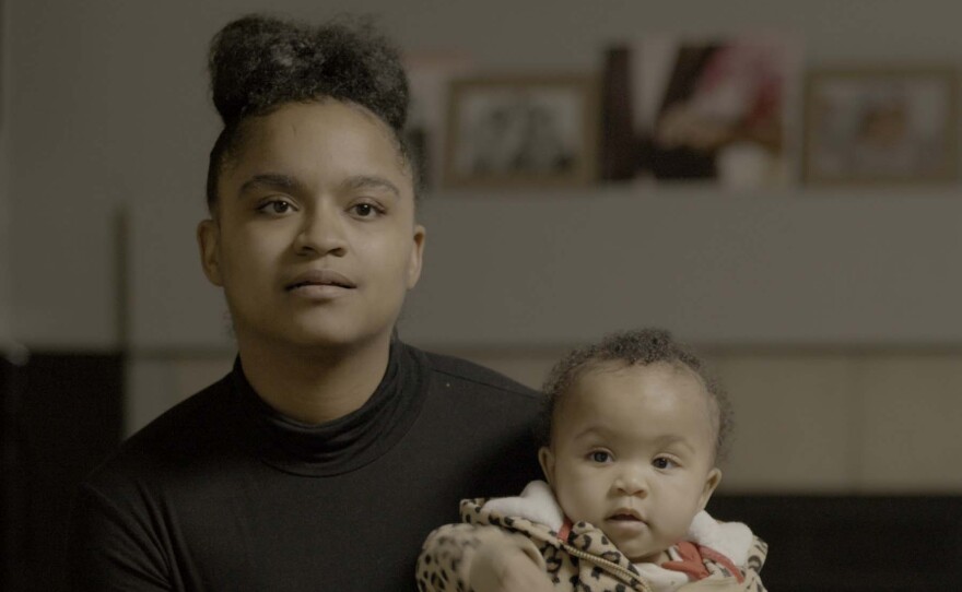 Gleneisha, holding a babyt opens up about her childhood without her mother, Danielle Metz, who was incarcerated with three life sentences when she was a young child.