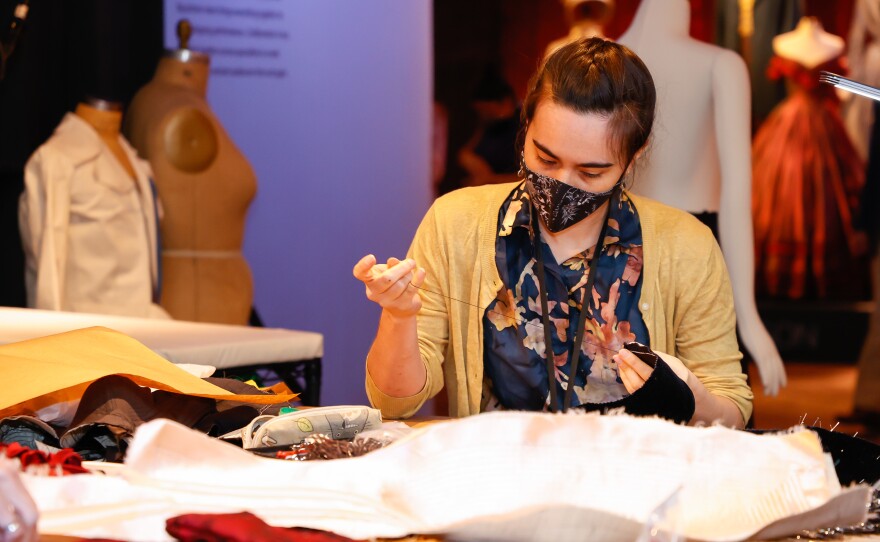 Gillian Conahan works at the <em>Showstoppers! </em>exhibition on Aug. 4, 2021, in New York City.